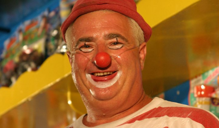 Clown with red nose and red hat