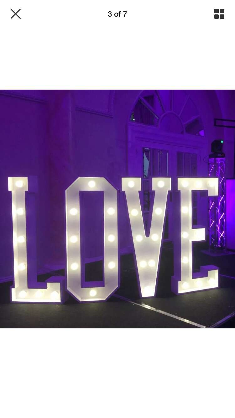light up love letters on purple background